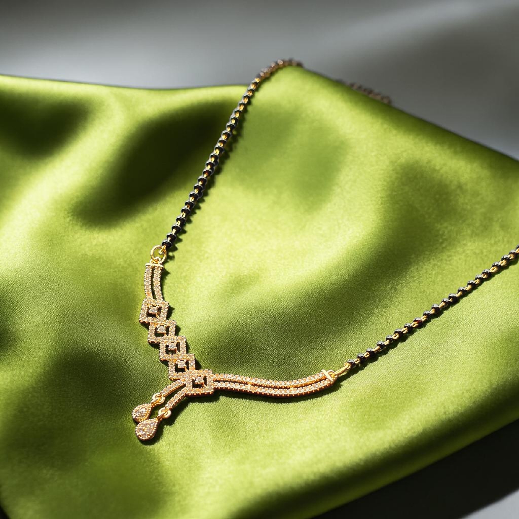 Elegant Gold-Tone Mangalsutra with Geometric Diamond-Studded & Black Bead Chain