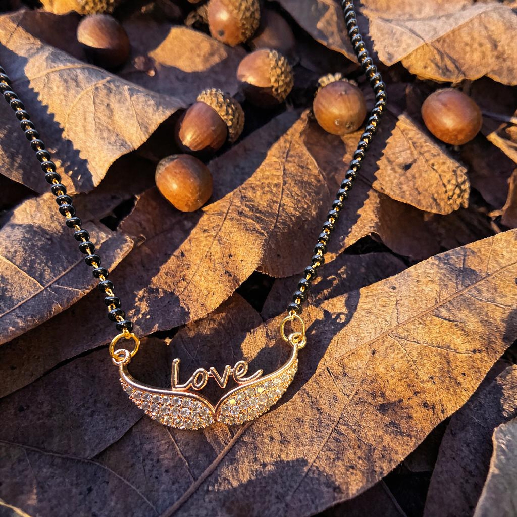 Stylish Love Script Mangalsutra with Sparkling Stones.